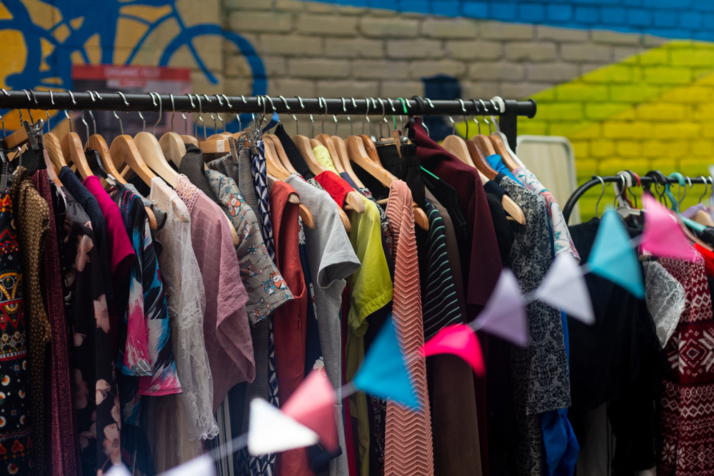 Clothes on a rail in a charity shop